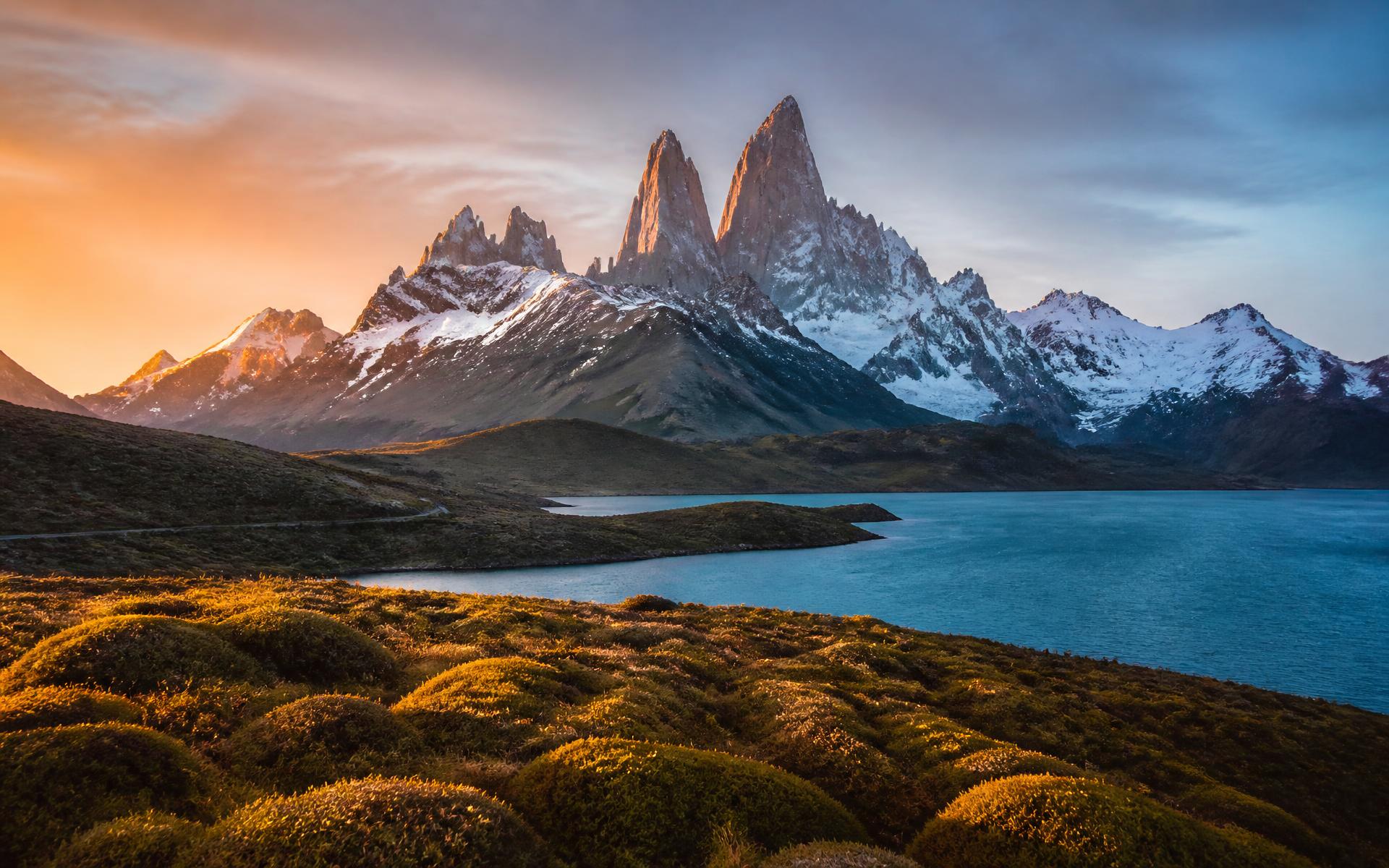 Jagged granite peaks above a glacial lake at sunrise in Patagonia