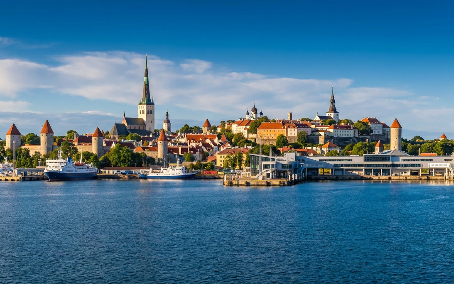 Tallinn harbour with the medieval Old Town spires and town wall towers above the passenger port, Estonia