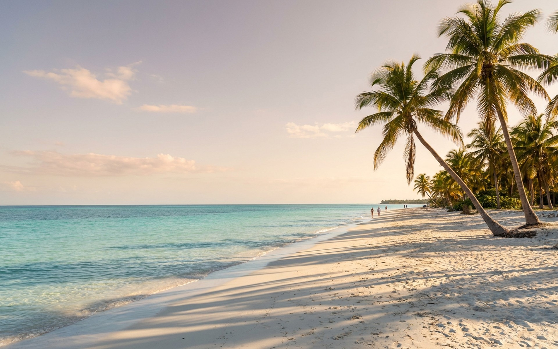 Golden hour light casting long shadows across pristine white sand beaches and turquoise Caribbean Sea with scattered palm trees. at Jardines del Rey, Cuba — original Triple VIP destination visual.