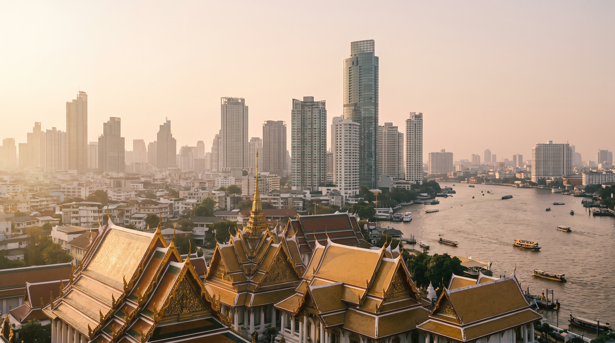 gilded Thai temple roofs against the modern city with the Chao Phraya beyond at Bangkok, Thailand, in early morning light — original Triple VIP destination visual.