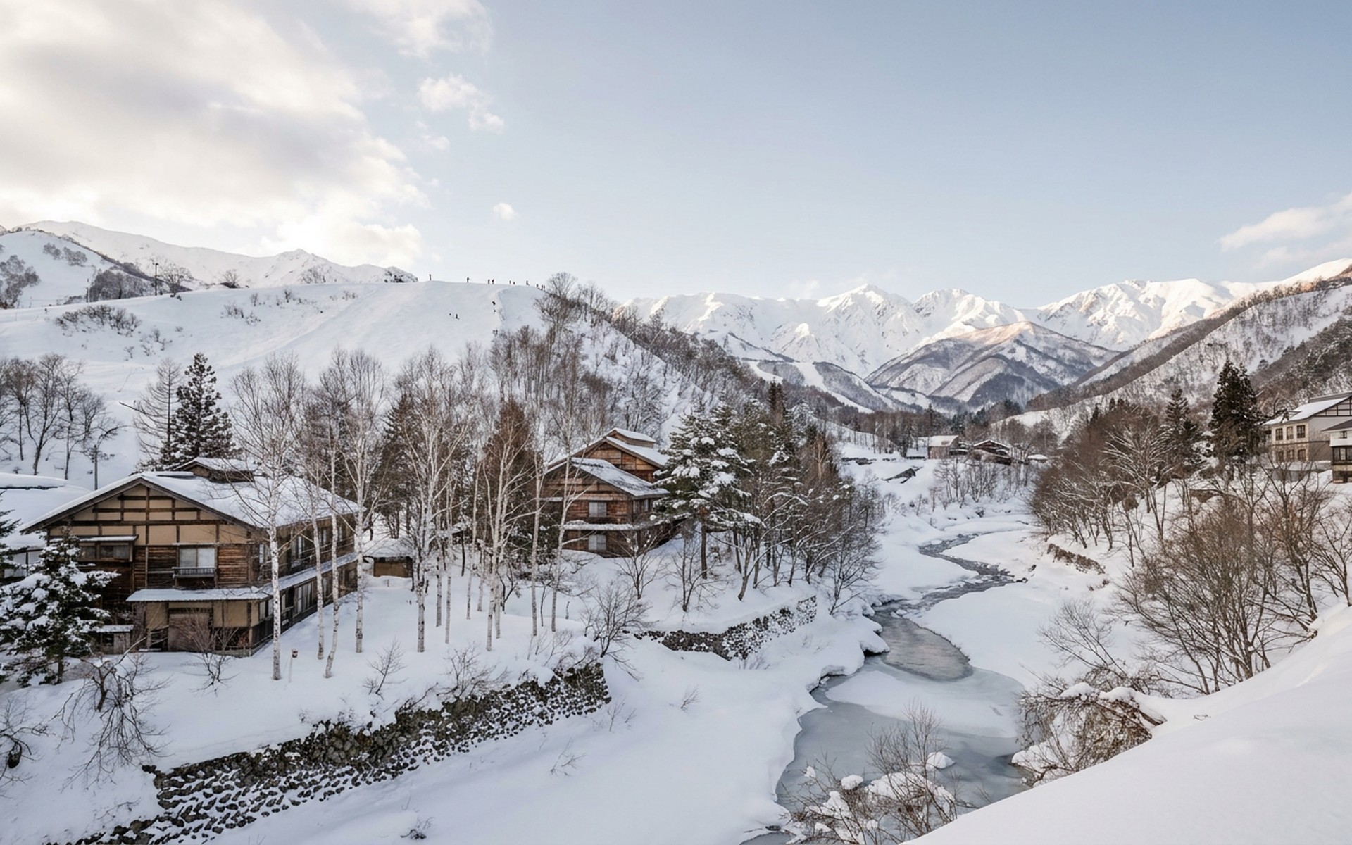 Deep powder snow covering alpine slopes of Hakuba Happo-One, with traditional Japanese ryokans nestled amidst white birch trees in winter. at Hakuba Valley, Japan — original Triple VIP destination visual.