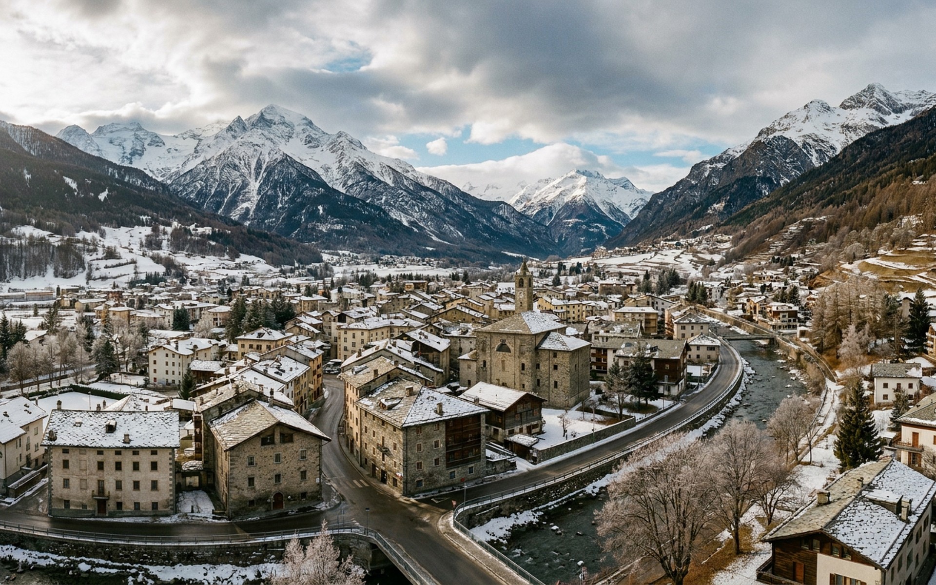 Majestic winter scene of snow-covered peaks surrounding the historic town of Bormio, with ancient stone buildings nestled in the valley. at Bormio, Italy — original Triple VIP destination visual.