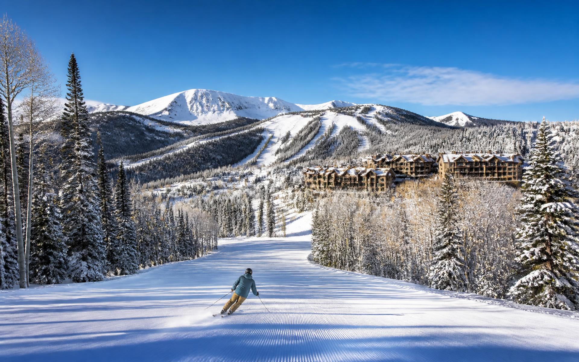 groomed ski runs through aspen and pine below timber mountain lodges at Deer Valley & Park City, Utah — original Triple VIP destination visual.
