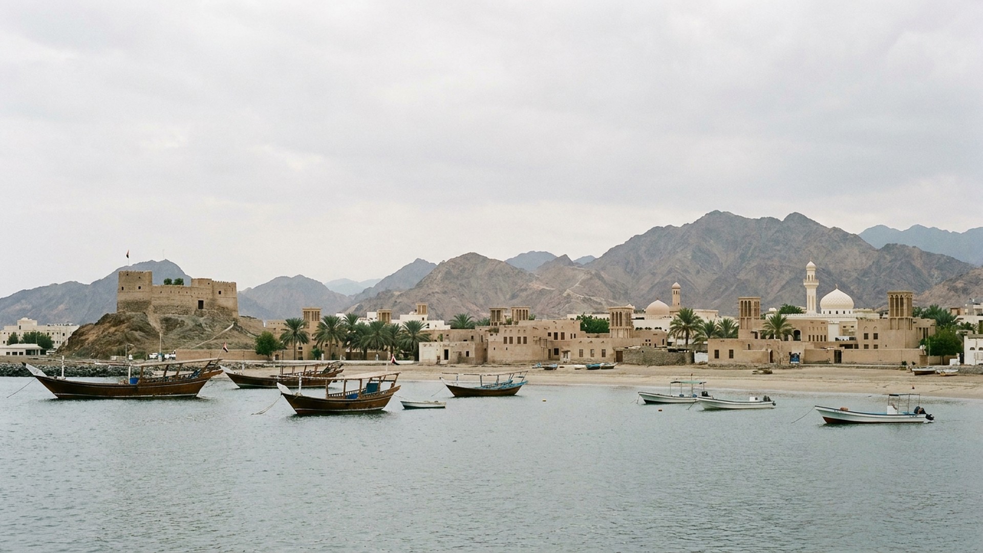 Wide calm bay and the town behind it in Fujairah, United Arab Emirates