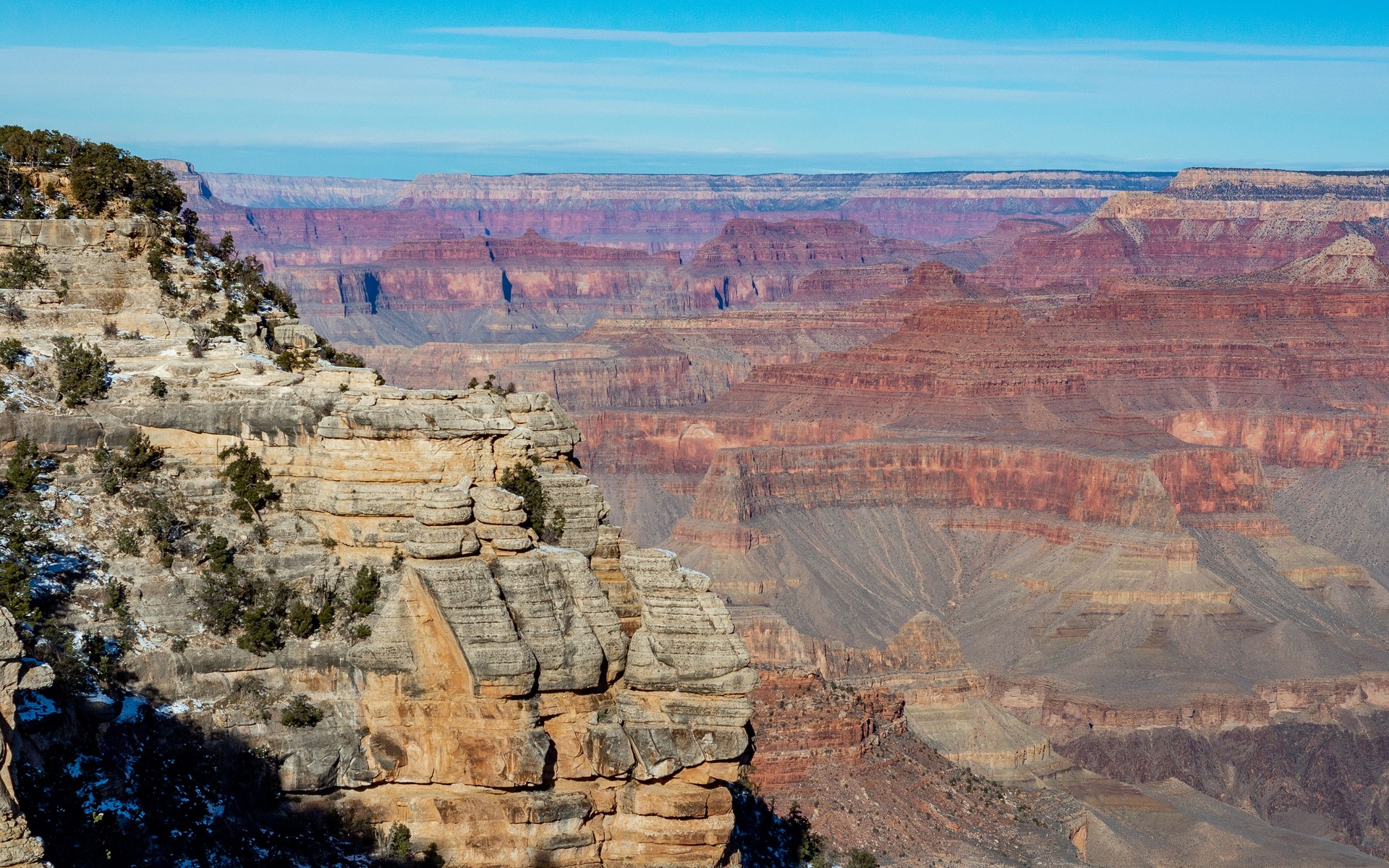 Breathtaking view of the Grand Canyon West showcasing its colorful rock formations and vast landscape.