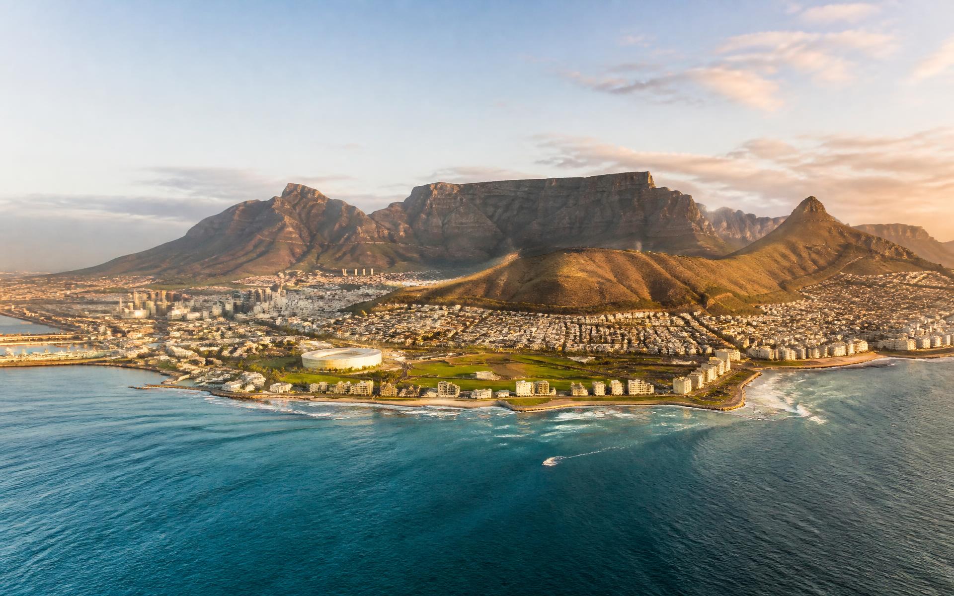 Table Mountain rising above the city bowl and Atlantic coastline of Cape Town, South Africa