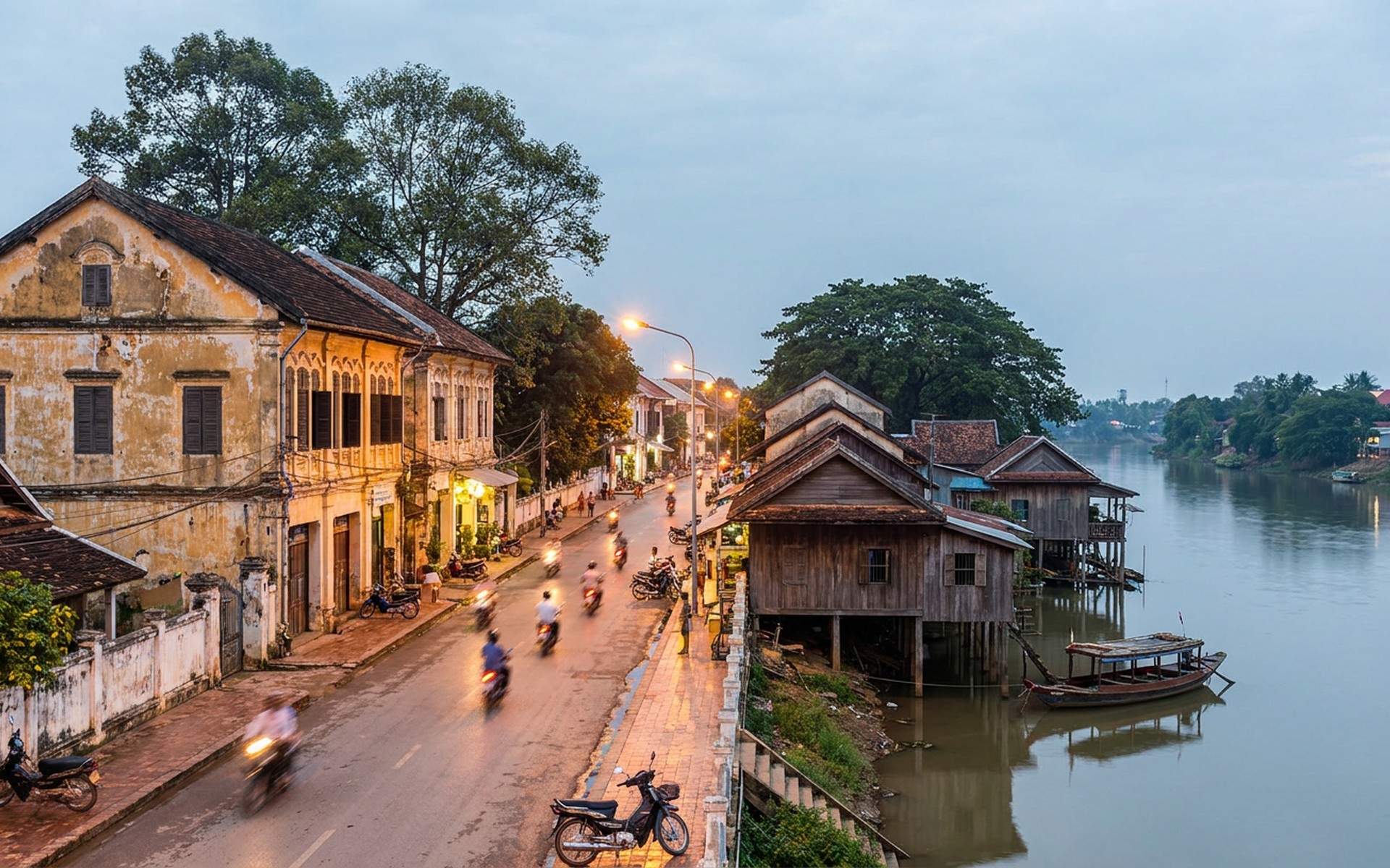 French colonial architecture and bustling streets along the Sangkae River, with traditional Cambodian houses and vibrant daily life at dusk. at Battambang, Cambodia — original Triple VIP destination visual.