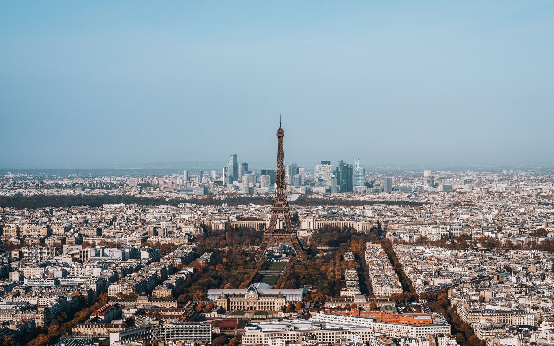 Breathtaking aerial view of Paris with Eiffel Tower, capturing iconic cityscape.