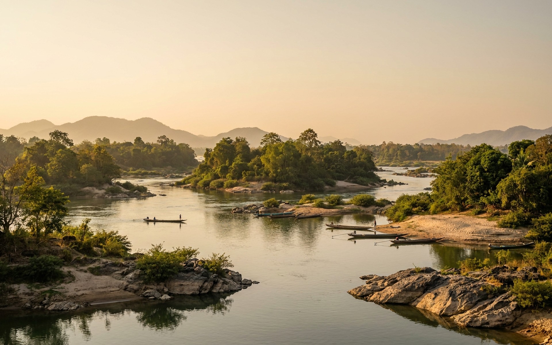 Golden hour light illuminates the tranquil waters of the Mekong River, dotted with verdant islets and traditional wooden fishing boats during the dry season. at Si Phan Don (4000 Islands), Laos — original Triple VIP destination visual.