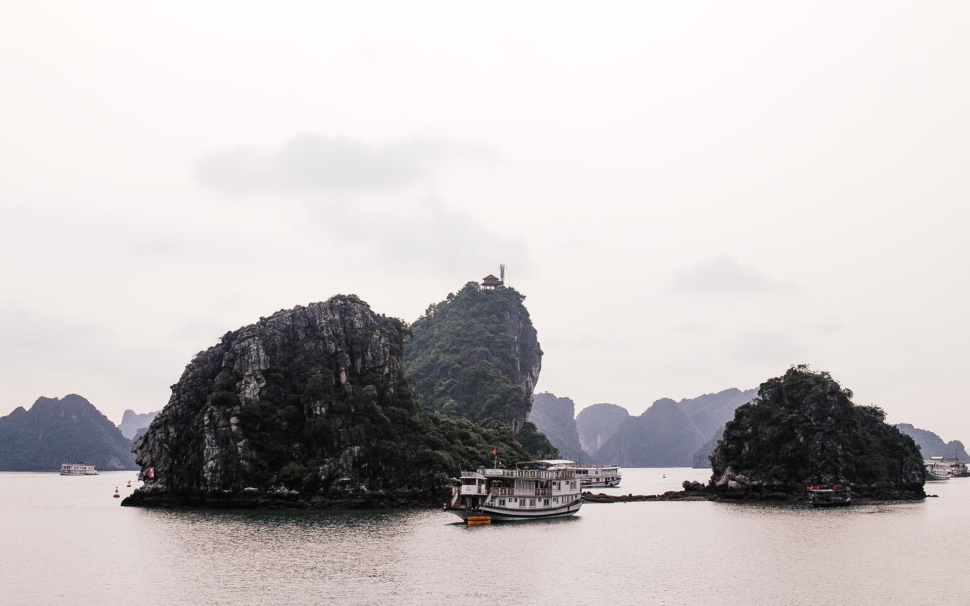Stunning landscape of Ha Long Bay with tourist boats and limestone karsts in Vietnam.